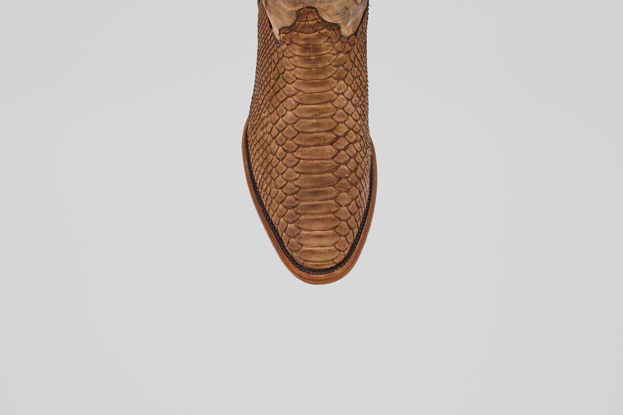 The Tanner - Tamarindo - Round Toe boot features a brown snakeskin-inspired design, showcased from above and centered on a plain white background.