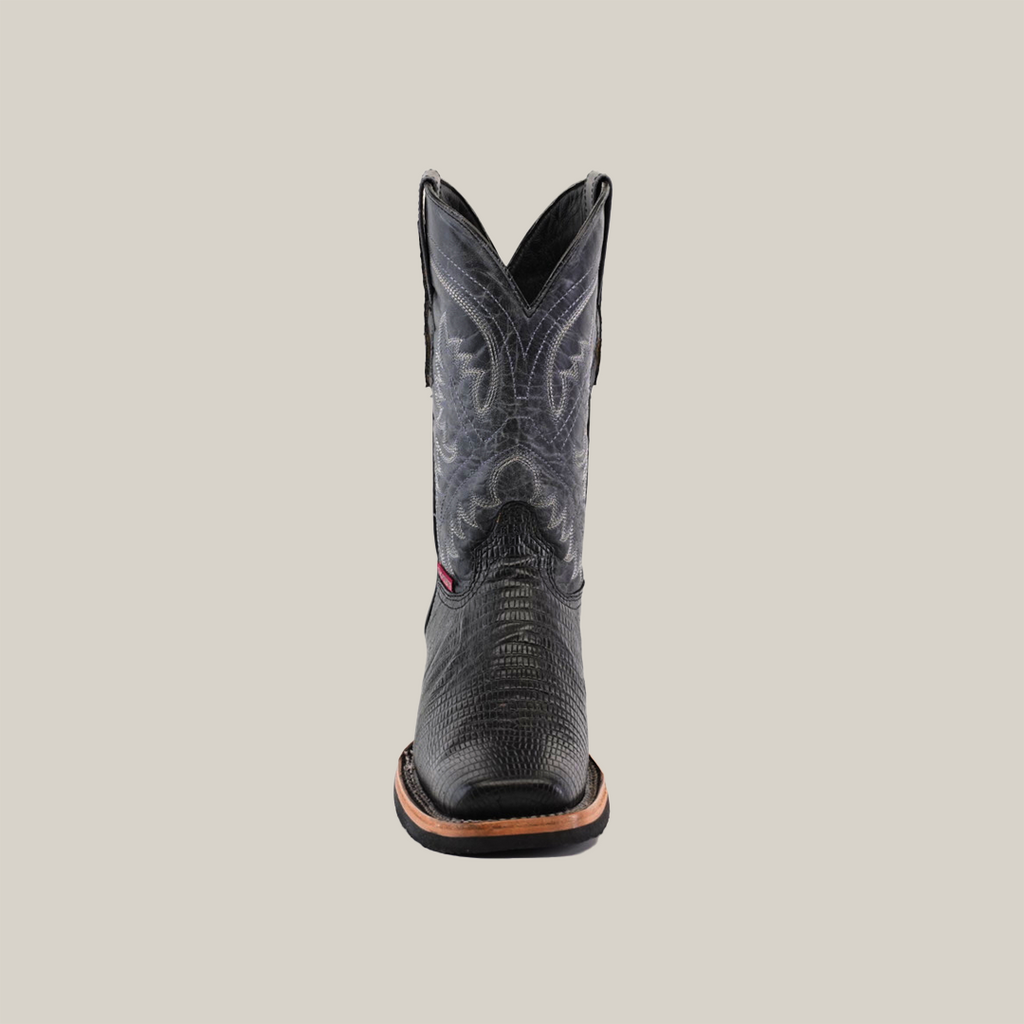 A Lizard Print Black boot, featuring a slip-resistant sole and rodeo toe, stands upright against a plain white background. It boasts textured patterns and detailed stitching on the shaft.