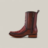 The Exotic Caiman Brandy boot, made from high-quality caiman leather, boasts a unique crocodile texture and side embroidery. Designed with a narrow square toe, it offers a convenient side zipper and a sturdy, slightly elevated wooden heel for effortless western style.