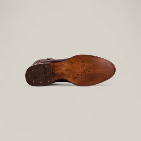 The Wyatt - Camel - Roper Toe premium leather dress shoe is shown from the sole, displaying stitching details and branding with Handmade in Italy and Dexter Smith. A plain light background highlights its craftsmanship.