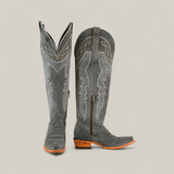 The Celine Gray - Tall Shaft - Snip Toe womens boots feature gray suede, decorative stitching, wooden heels, pointed toes, and a side zipper, shown against a plain beige background.
