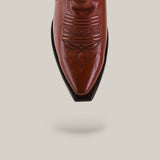 The Marjorie Star Brown - Tall Shaft - Snip Toe boot is displayed from above, highlighting its brown leather, snip toe, and decorative stitching on a light beige background with a subtle shadow.