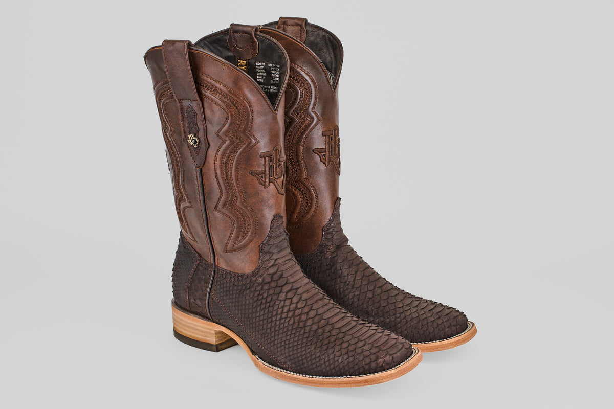 A pair of Tanner - Matte Brown - Square Toe cowboy boots featuring brown leather shafts, dark textured Python Cafe Nobuck foot, decorative stitching, and light wooden heels.