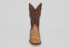 The Conor - Matte Orix - Narrow Square Toe features a single cowboy boot with textured tan Pirarucu leather in a matte finish and a dark brown, intricately stitched upper, shown on a plain light gray background.