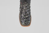 The Conor - Charcoal - Square Toe is a black cowboy boot with a square toe and brown sole, ideal for men seeking stylish western footwear.