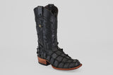 The Conor - Matte Black - Narrow Square Toe cowboy boot features textured fish leather, detailed shaft stitching, and a wooden heel, shown as a single black boot on a plain light gray background.