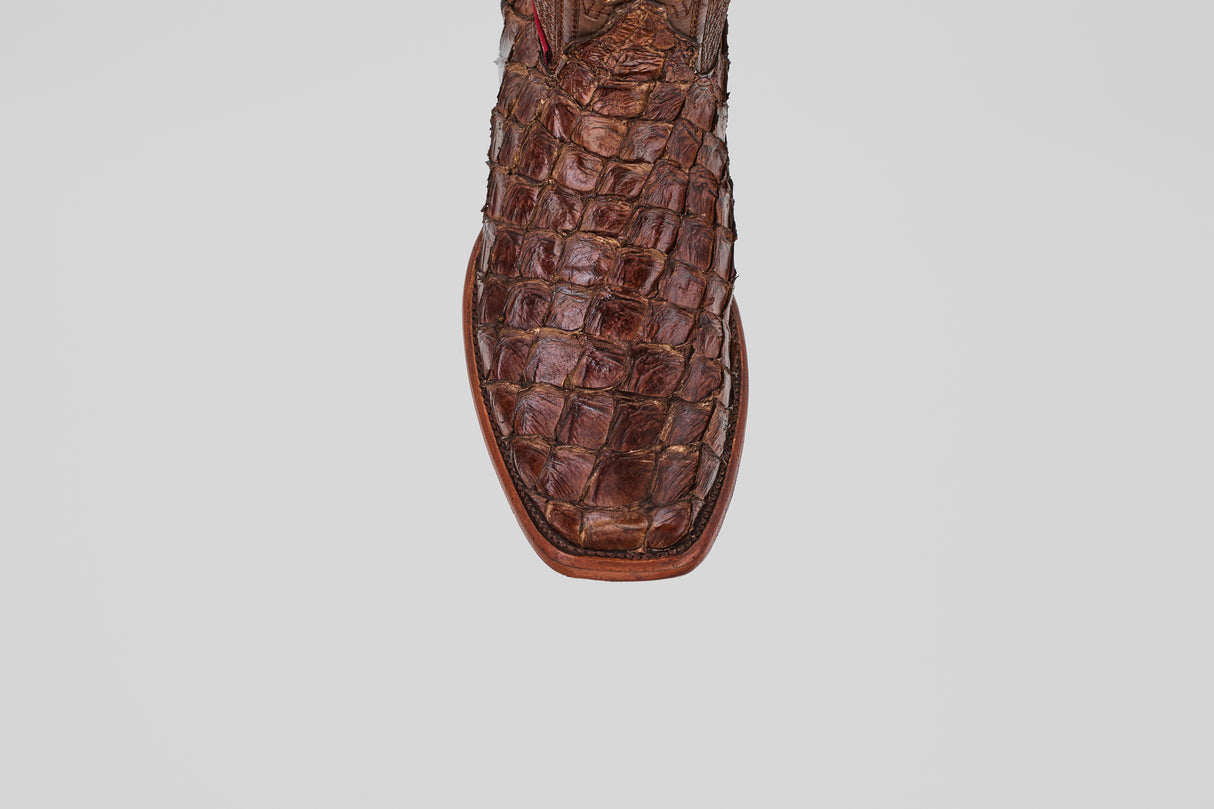 Close-up of the toe of the Conor - Brown - Narrow Square Toe boot, crafted from textured, patterned leather, against a plain white background.