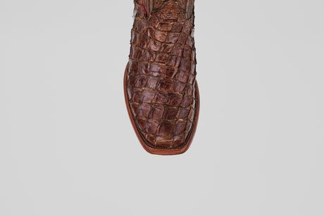 Close-up of the toe of the Conor - Brown - Narrow Square Toe boot, crafted from textured, patterned leather, against a plain white background.
