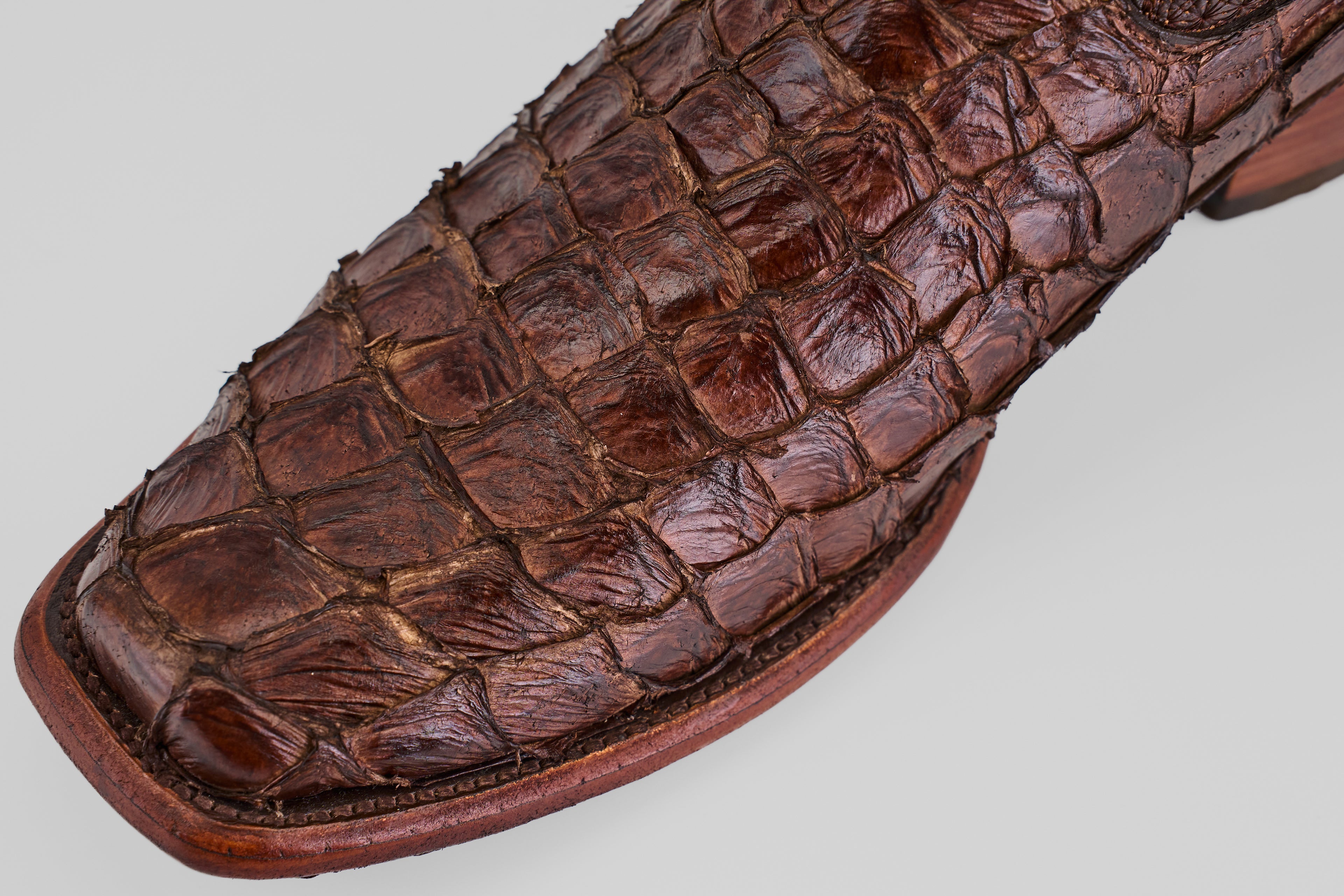 A close-up of the Conor - Brown - Narrow Square Toe boots highlights their detailed stitching and refined shape.