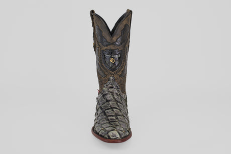 The Conor - Charcoal - Roper Toe is a single ornate cowboy boot made from textured fish leather, featuring a roper toe and bold red sole, displayed upright on a plain light gray background.