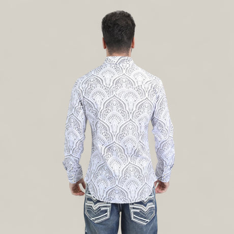 A man stands facing away, wearing the Mens Western Modern Fit Cotton/Spandex Long Sleeve White Shirt with Snaps (WPL10822) and blue jeans with white-stitched back pockets, against a plain beige background.